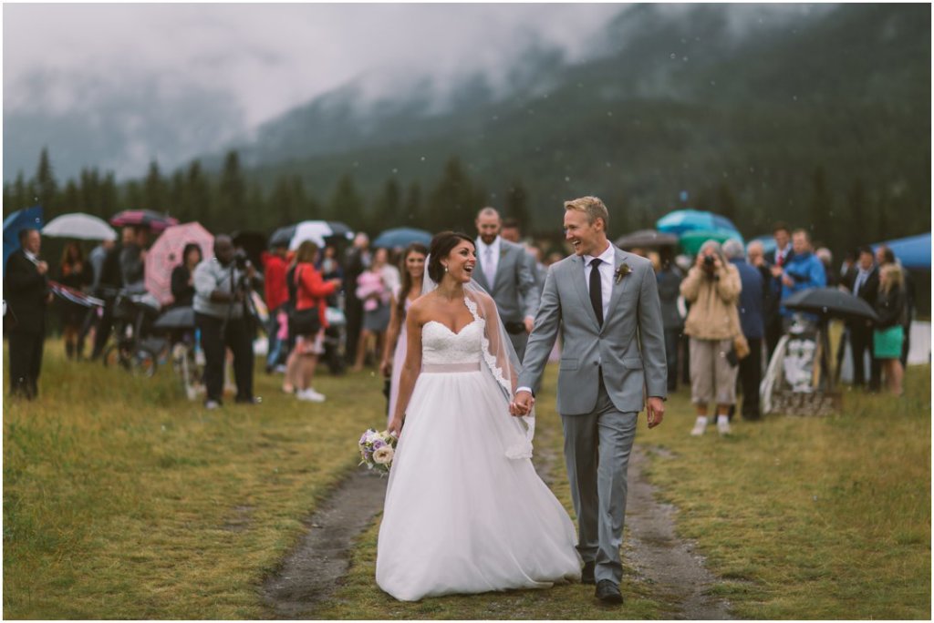 rainy canmore wedding corry lake park ceremony bride and groom exit