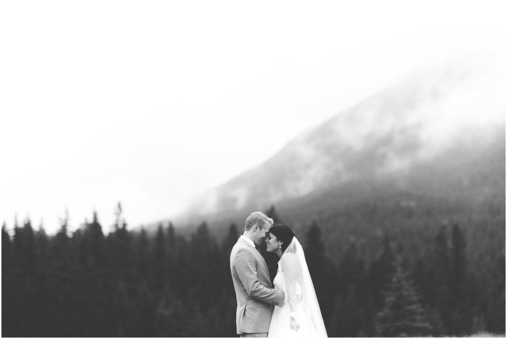 corry lake park canmore wedding bride and groom romantic raining august