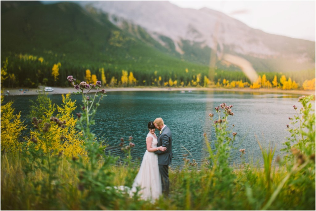 bride and groom at kananaskis lodge fall sunset