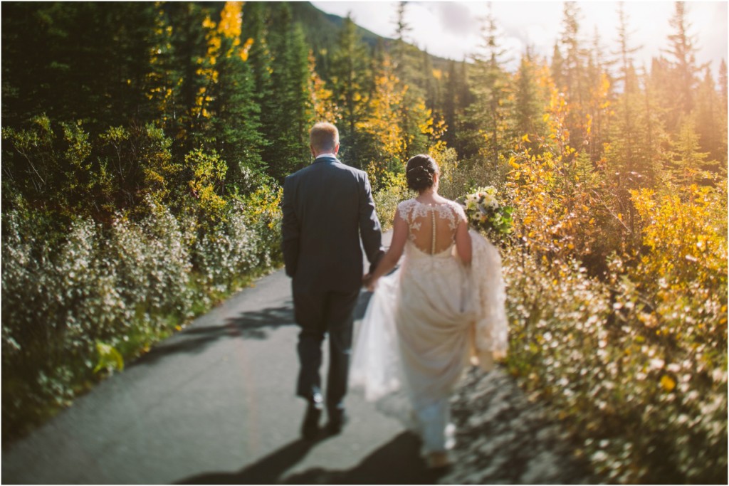 bride and groom at kananaskis lodge fall sunset