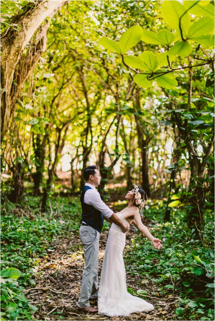 North Shore ke'e beach kauai hawaii elopement bride and groom at sunset in forest- photos by meg courtney