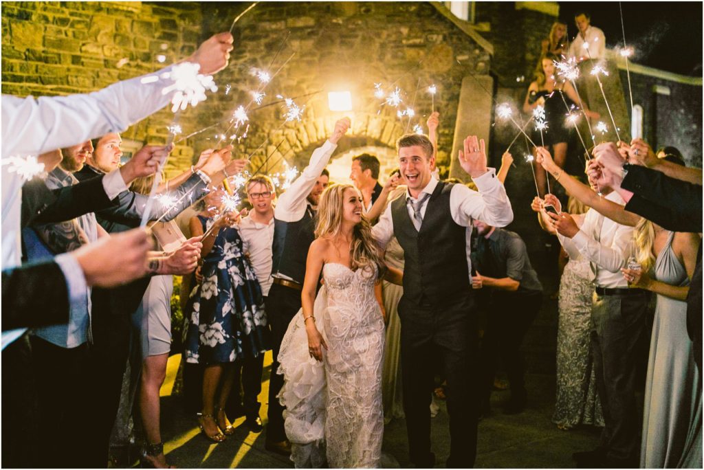 banff springs wedding bride and groom at sparkler exit meg courtney wedding photography