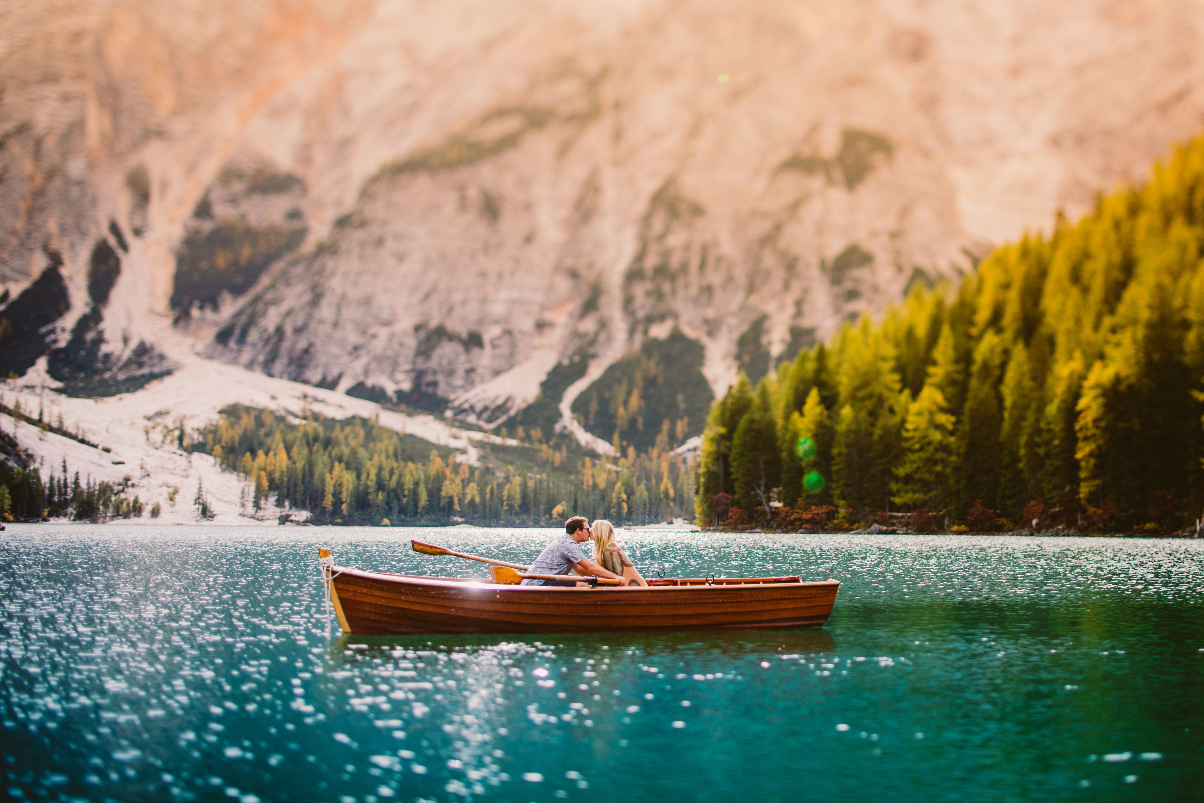 italy elopement bride and groom on a canoe in mountains photos by meg bradyhouse